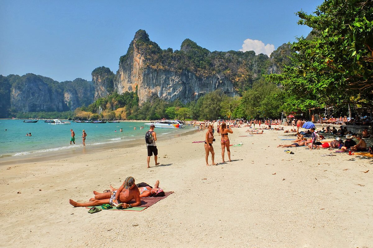 Vacationing people on Railay beach in Thailand Railay Beach