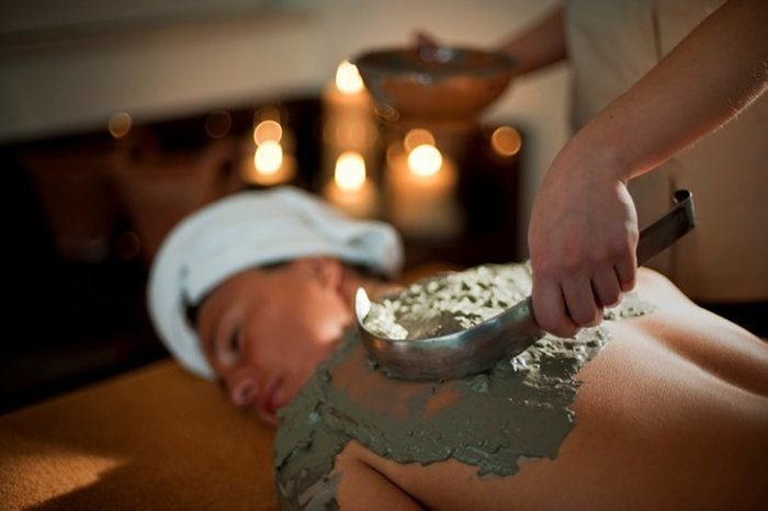 The girl is smeared with healing mud Vela Luka-mud resort