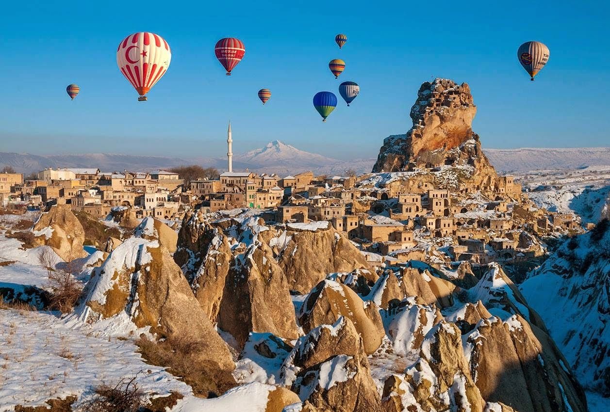 Hot air balloons over Goreme Winter National Park in Turkey Hot air balloons over Goreme