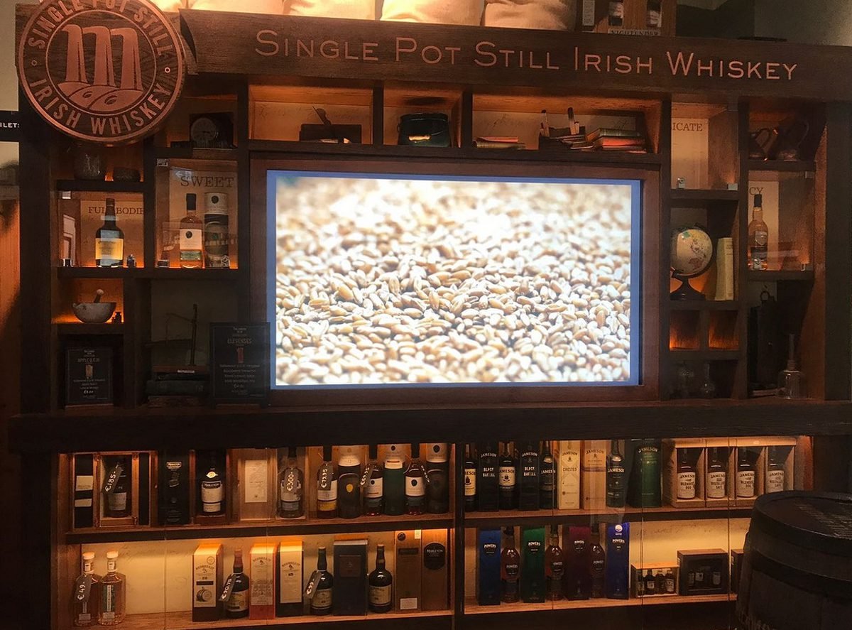 Photos of exhibits at the Irish Whiskey Museum Interactive introduction to the whiskey production process