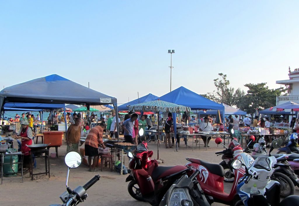 Parked bikes near makashnits with food on Koh Lan Island Makashnitsy with food
