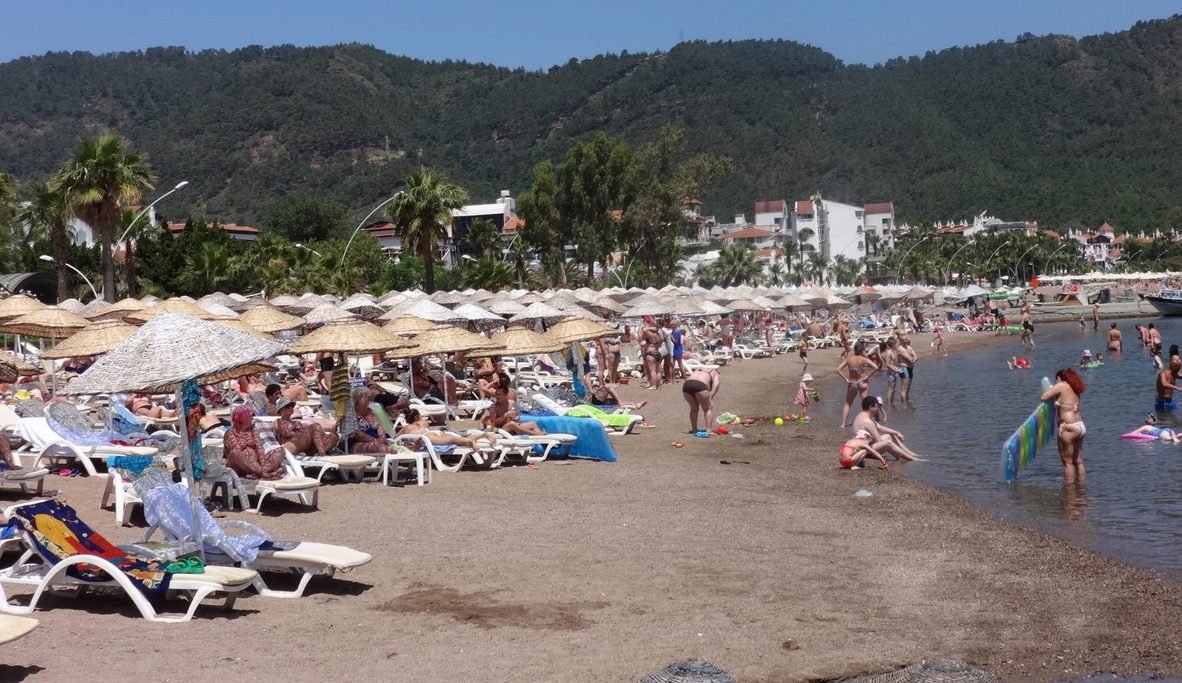Tourists vacationing on Icmeler beach Icmeler beach holidays