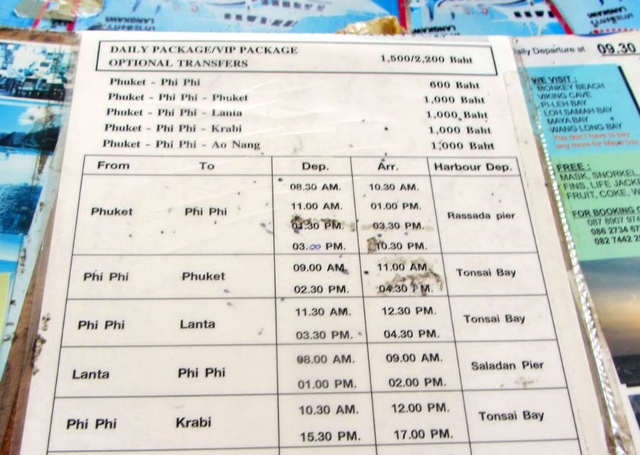Photo of a sign with the schedule and cost of ferry tickets from Rassada Pier to Phi Phi Schedule and cost of tickets from Rassada Pier