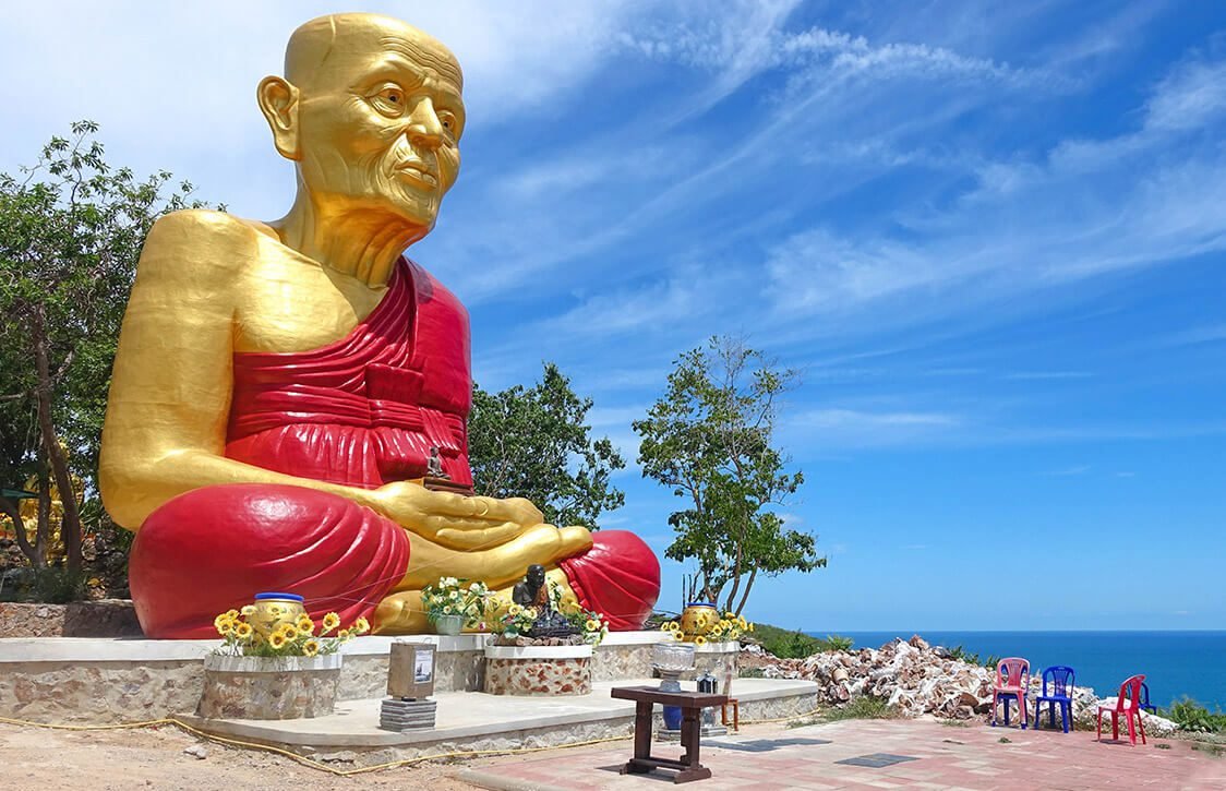 Gilded sculpture of a seated Buddha Sculpture of a sitting Buddha