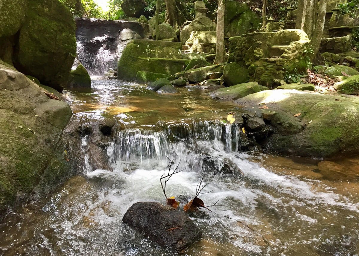 Photo of a mountain stream in the " Magic Garden” Water flowing down from the mountains