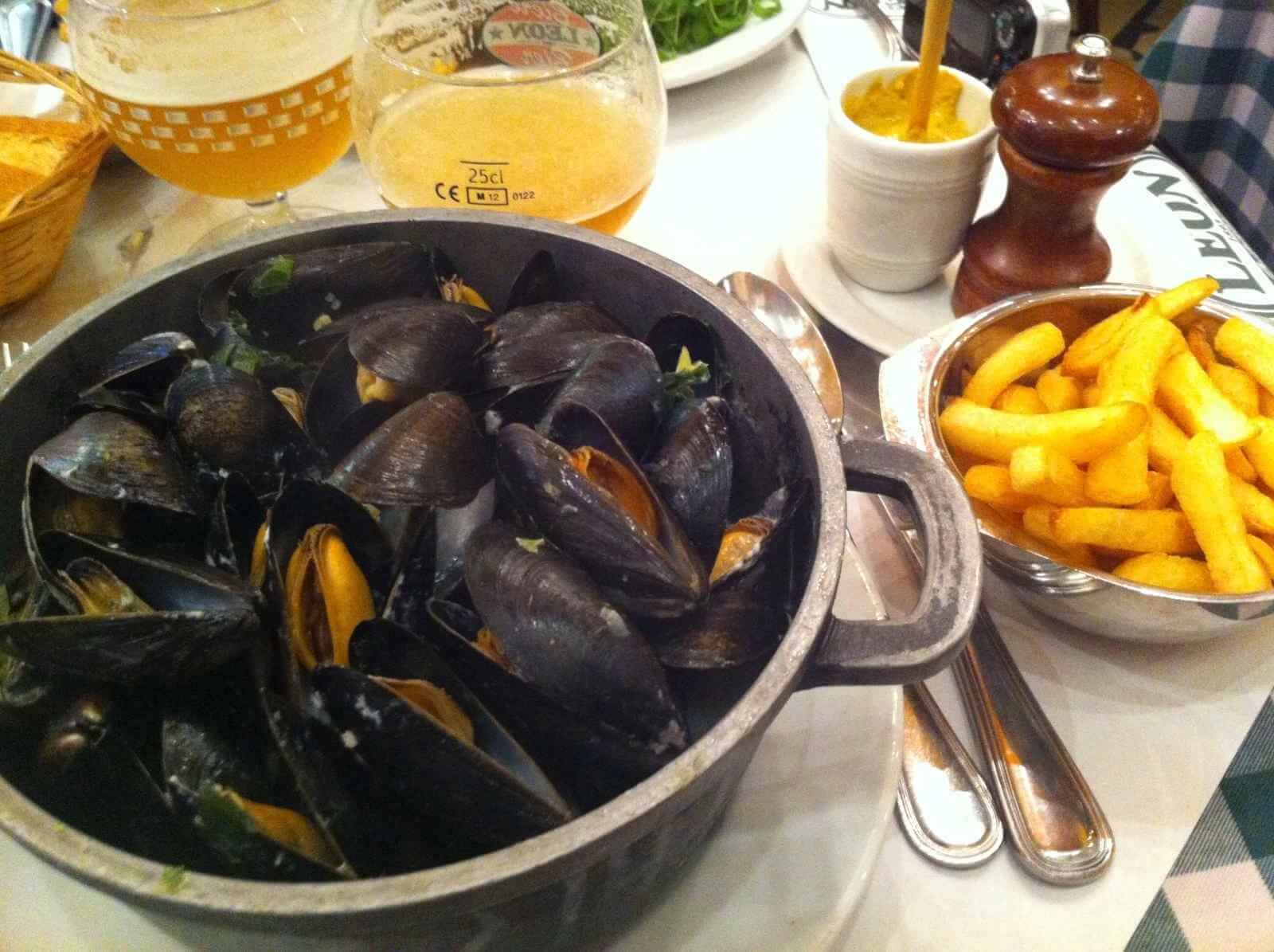 Photos of French fries and spicy mussels French fries and spicy mussels with a beer