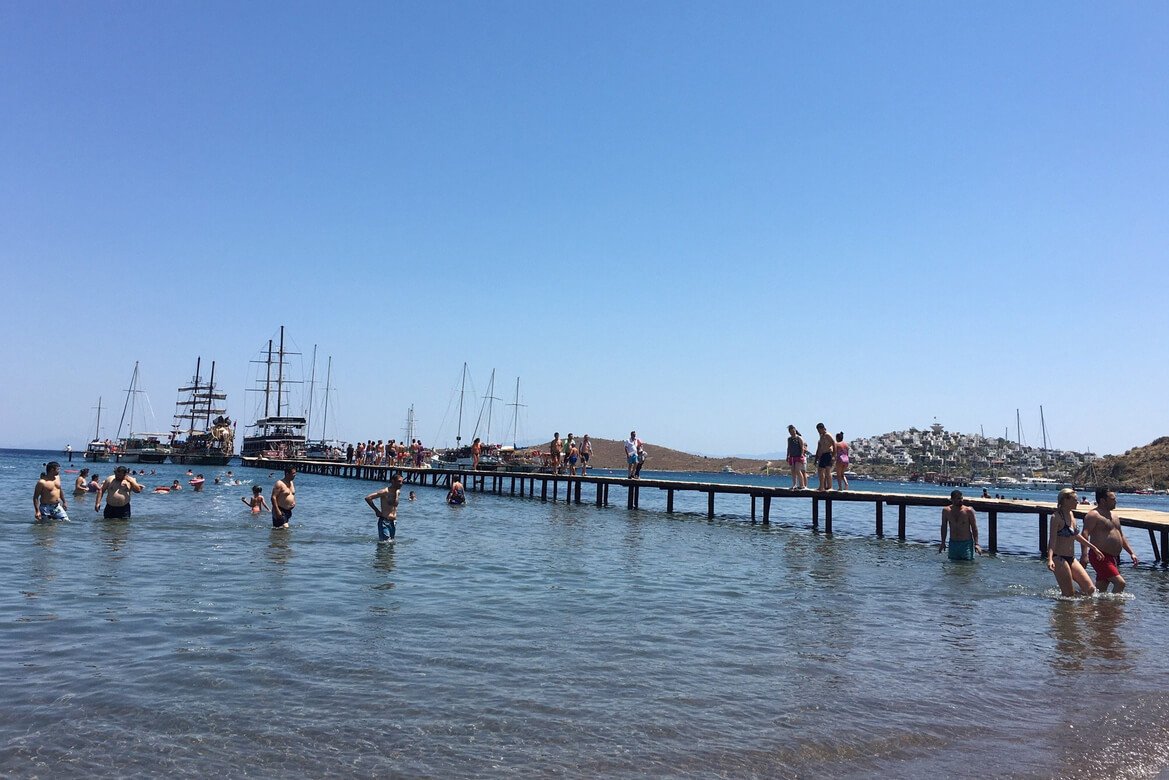 Berth with tourists coming to Camel Beach The beach is often visited by tourists on yachts