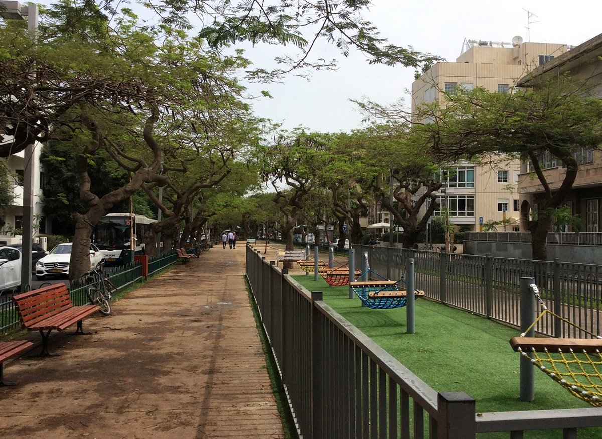 Park area with hammocks in the middle of Rothschild Boulevard, Tel Aviv Beautiful park area