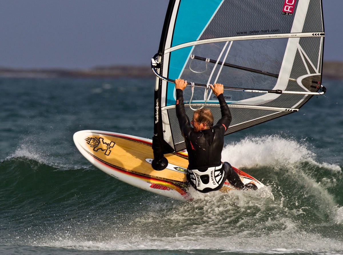 Photo of a windsurfer riding on Akyarlar beach Akyarlar Beach Windsurfing