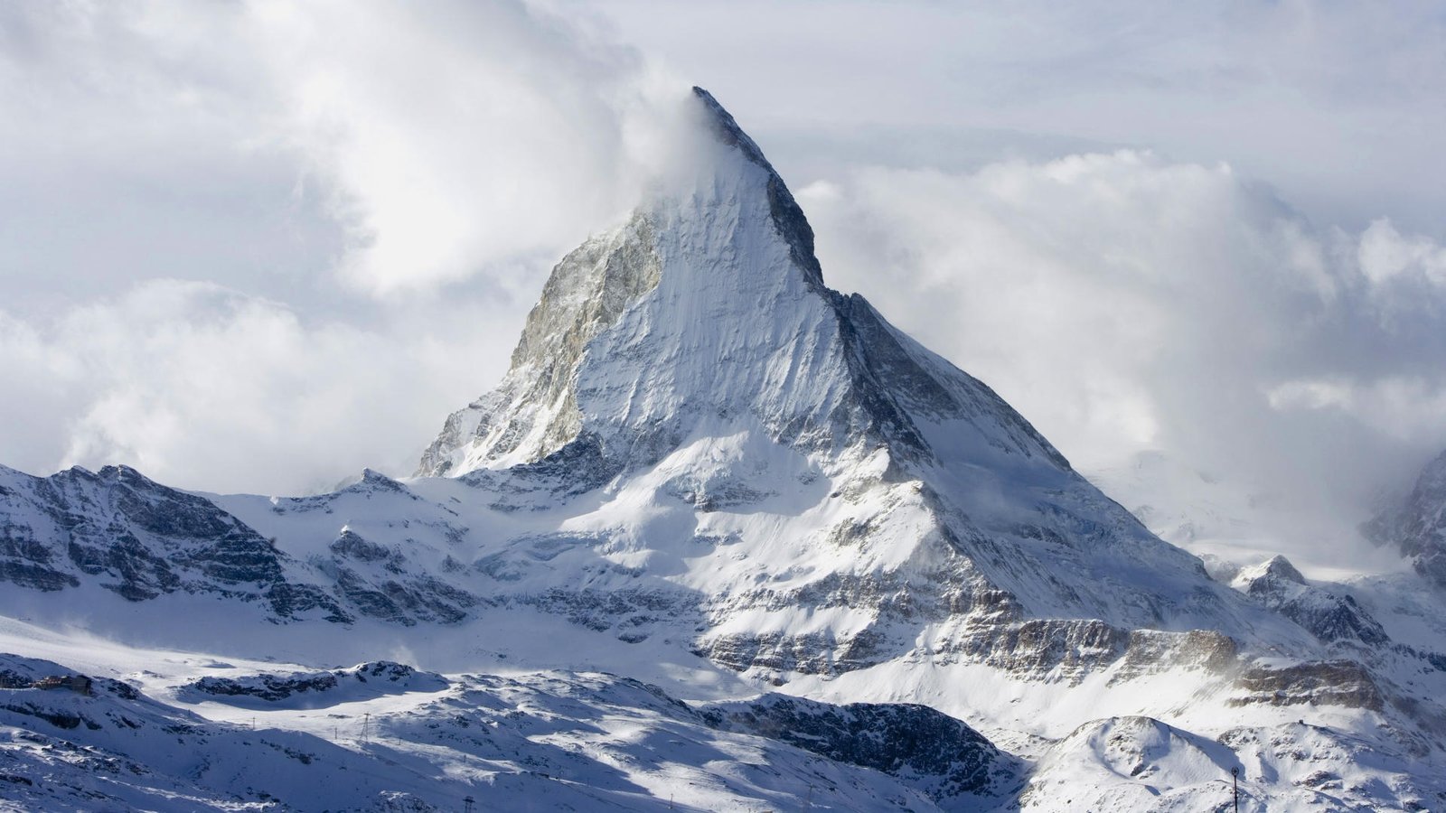 The Matterhorn mountain is covered with snow during the cold season The Matterhorn mountain is covered in snow