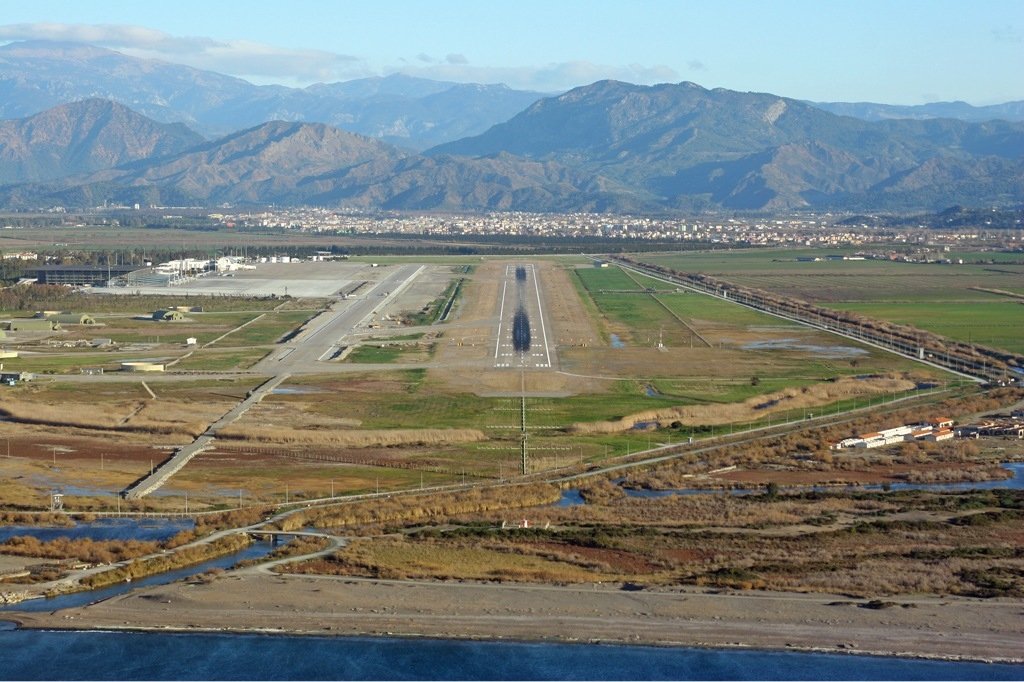 Dalaman airport runway with Turkish mountains background City of Dalaman