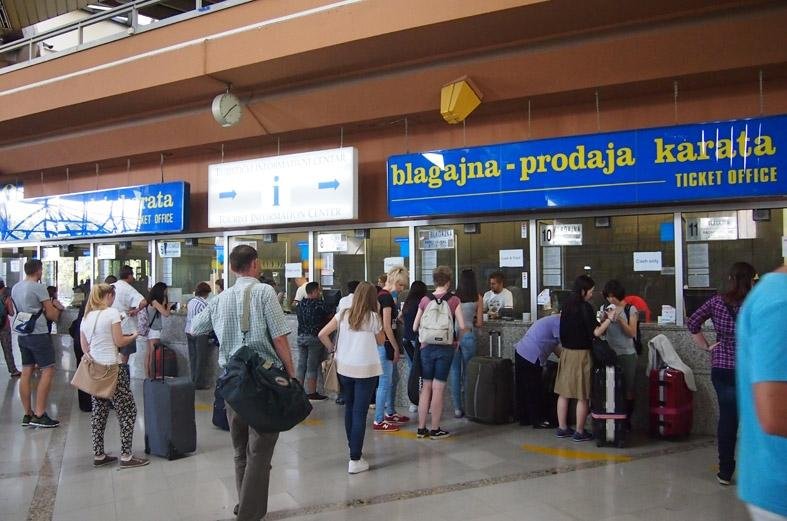 Photos of people at the ticket office at the Zagreb bus station Cash registers at a car dealership
