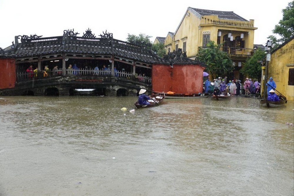 View of the rising water level on the background of the Japanese bridge Hoi An Flood