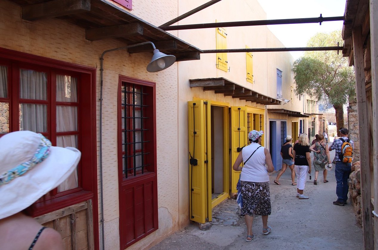 Restored part of Spinalongu Island Street Tourists on the restored street
