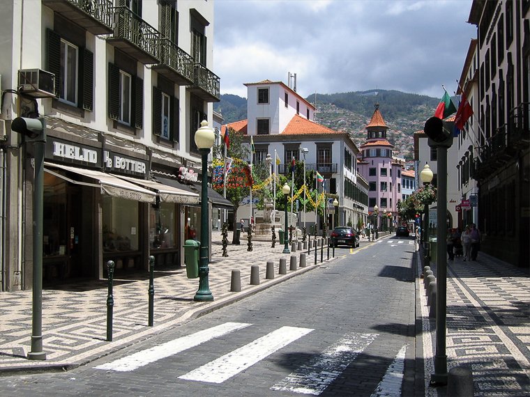 Photo of a street in Funchal Walking through the city streets