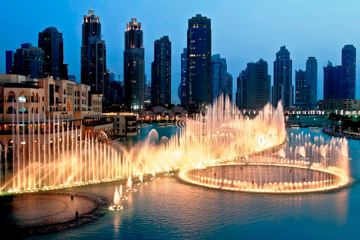 There is a fountain near the entrance to the Burj Khalifa There is a fountain next to the entrance