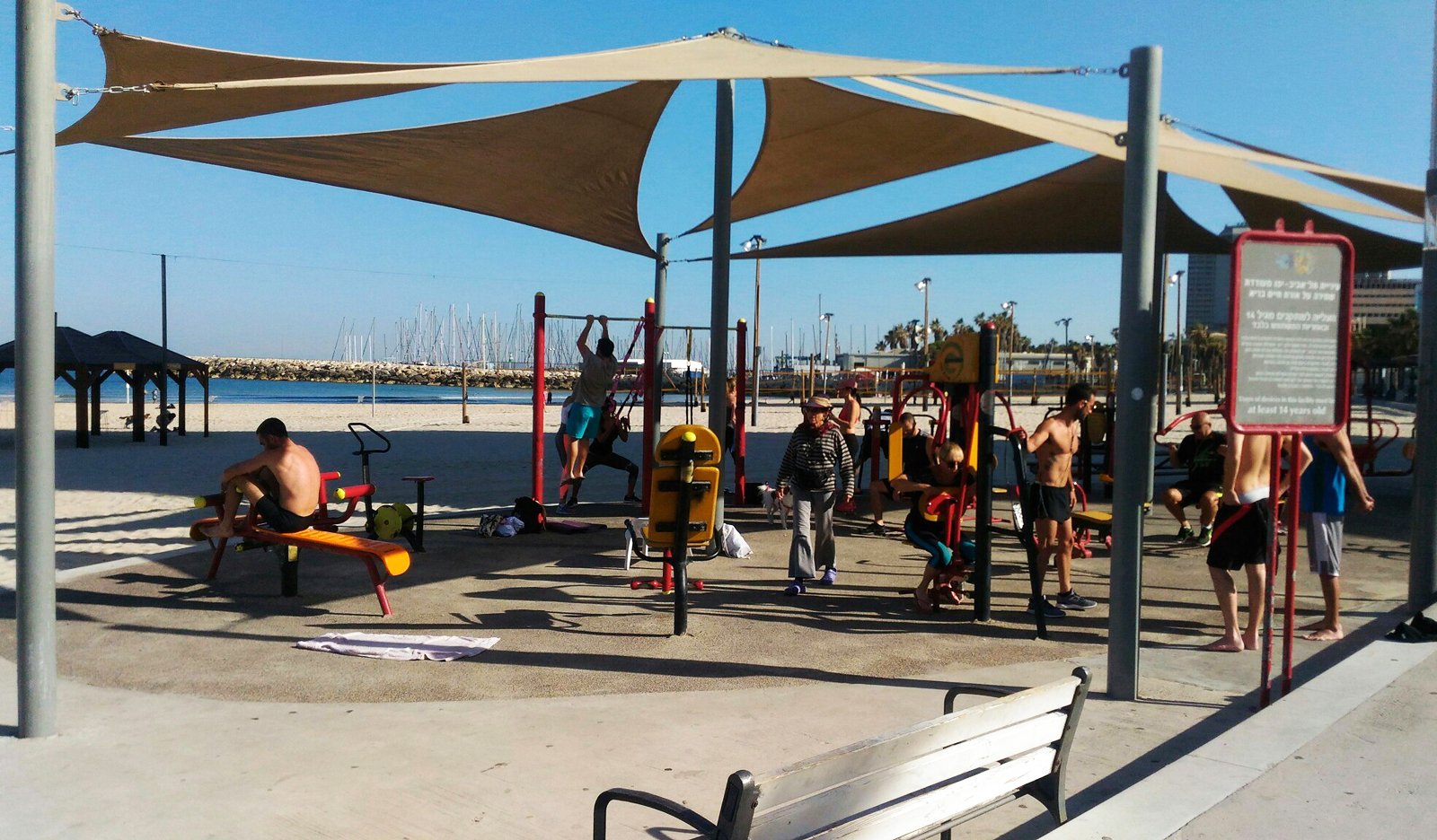 Sports ground with fitness equipment on the beach in Tel Aviv Simulator platform