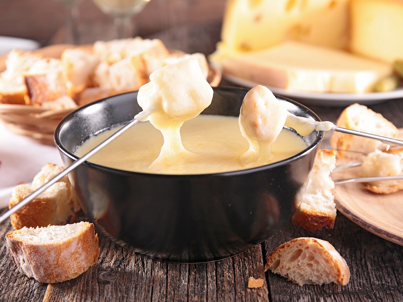 Soaked bread slices in fondue Cheese fondue