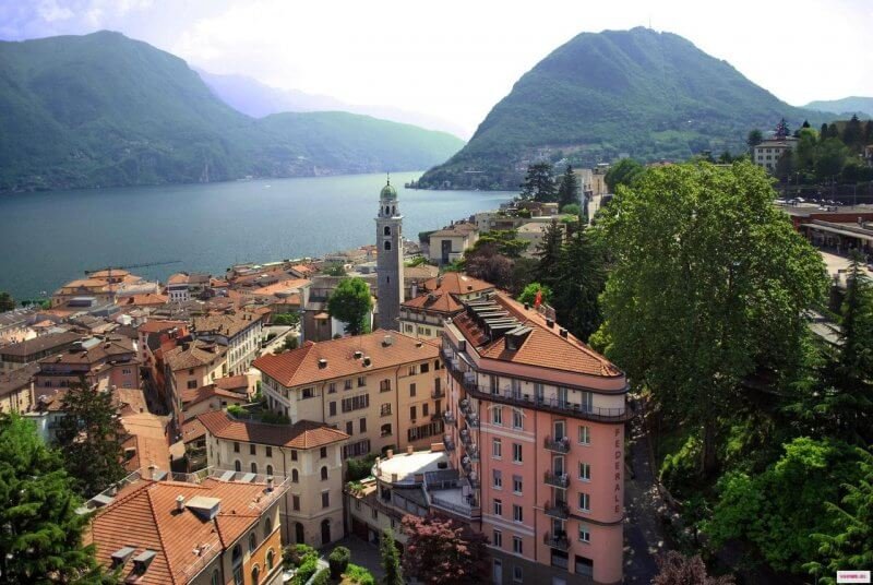 Photo: view of the lake and the city of Lugano in Switzerland Lugano city view