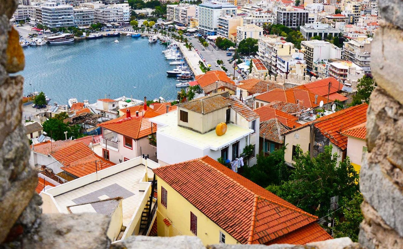 Red roofs of Greek town houses and marina view Kavala City Architecture