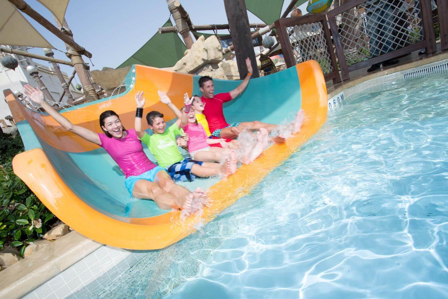 Family on rides at Yas Waterworld Family Pass for families