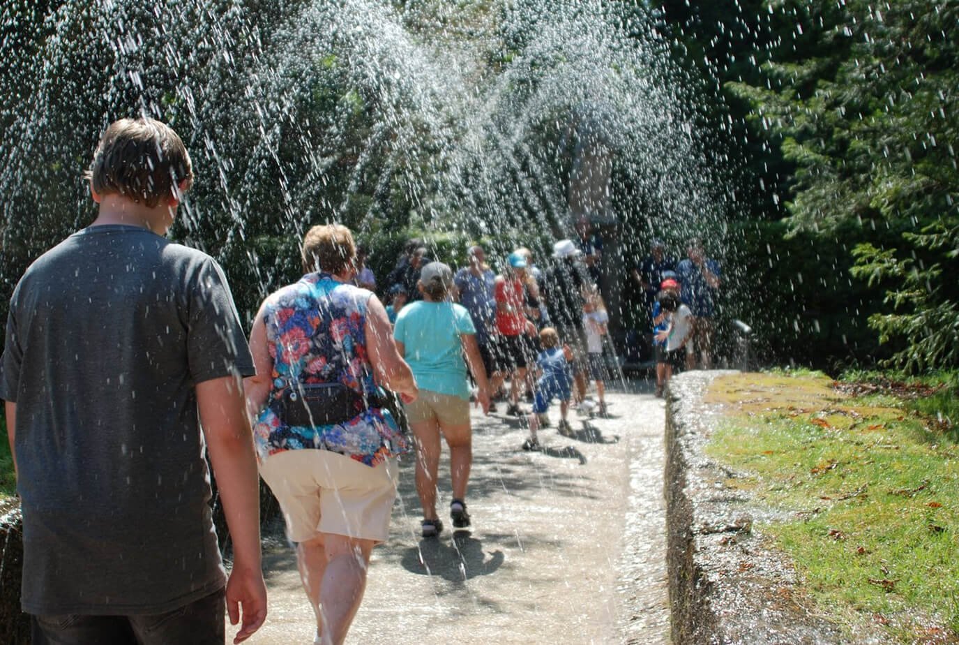 Turichts under the fountains of Helbrunn Castle in Salzburg Fountains of Helbrunn Castle