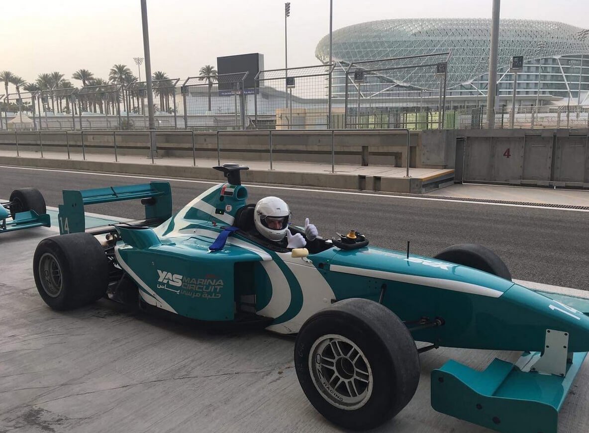 Photo of a racing car on the Yas Marina highway Race car tour of the track