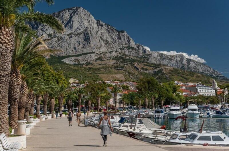 Palm trees and snow-white boats on the Baska-Vody embankment Baska Embankment-Voda