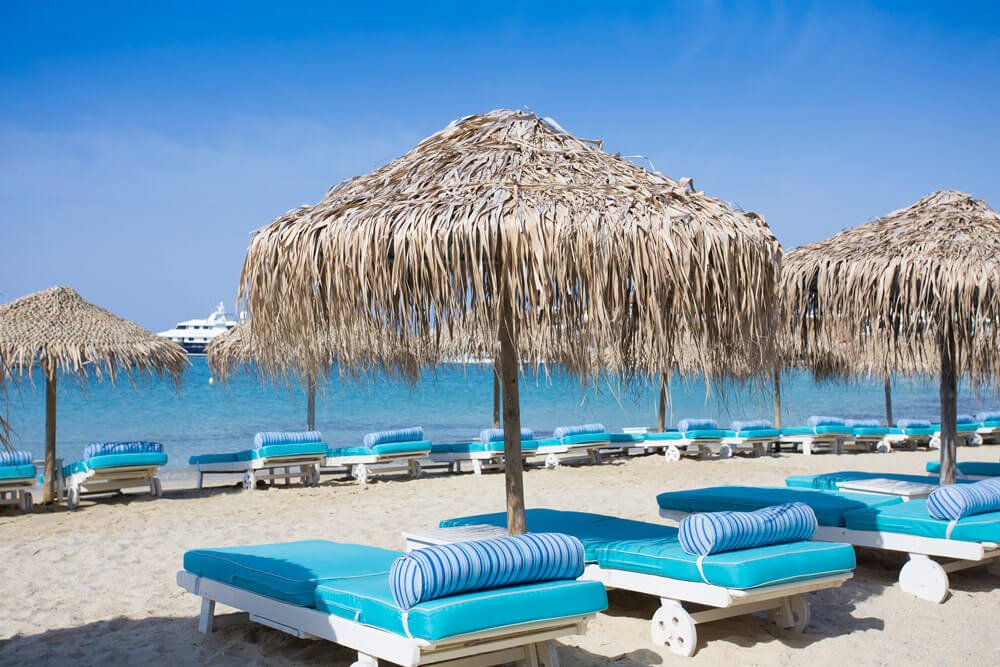 Photo of sunbeds on the beach Patis Gialos These are the sun loungers on the beach of Patis Gialos