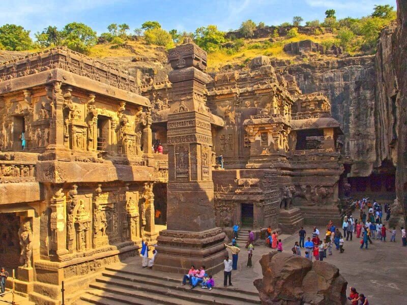 Tourists near the temple in Ellora, India Tourists near the temple in Ellora