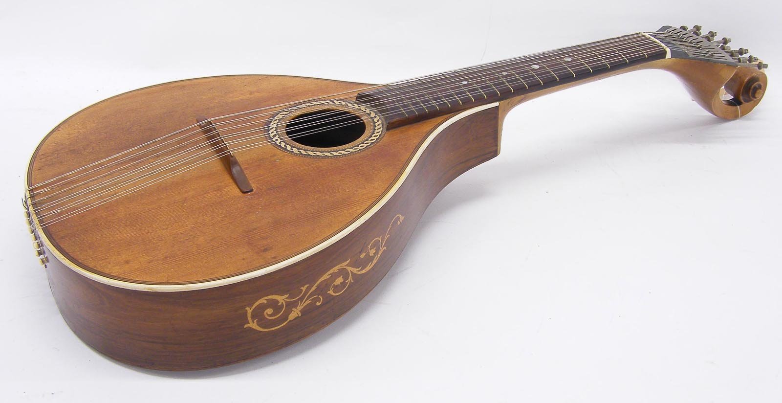 A 12-string Portuguese guitar that resembles a large mandolin. 12 string Portuguese guitar