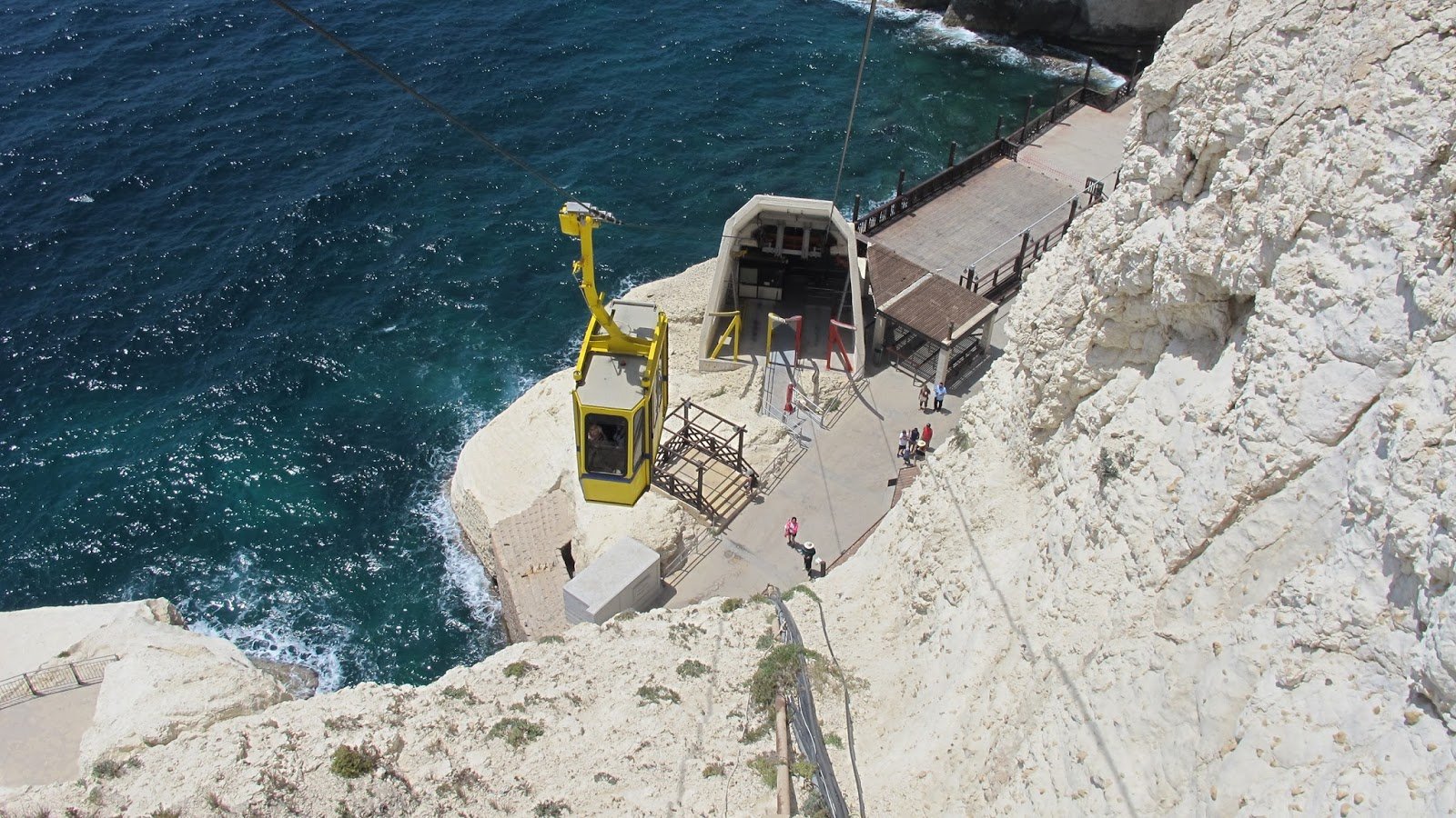 Yellow cableway ride down to Rosh Hashanah Grotto Cable car to the grotto
