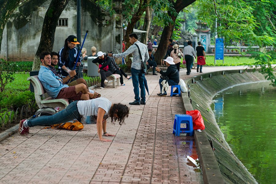 Locals in the park on the shore of the lake of the Returned Sword Park on the shore of Lake of the Returned Sword