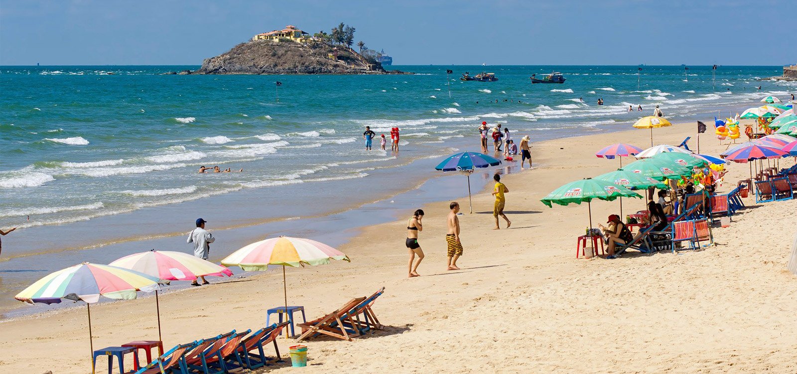 High chairs and umbrellas at the back beach of Vung Tau Back City Beach