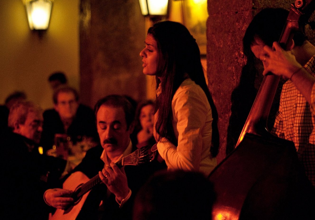 Photo of a girl - fado performer Traditional Portuguese music is playing