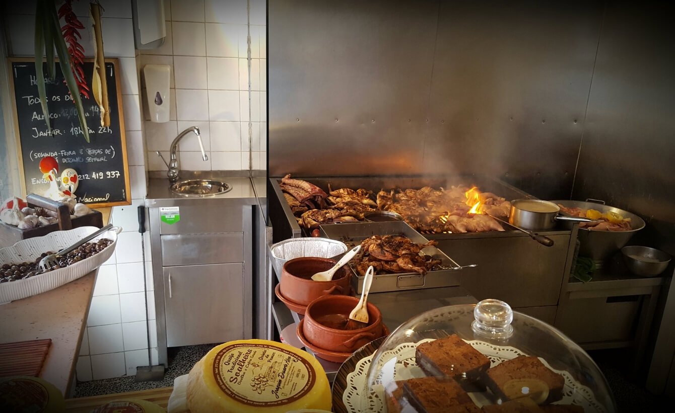Grilling process at Frangasqueira Nacional Cooking on a huge grill