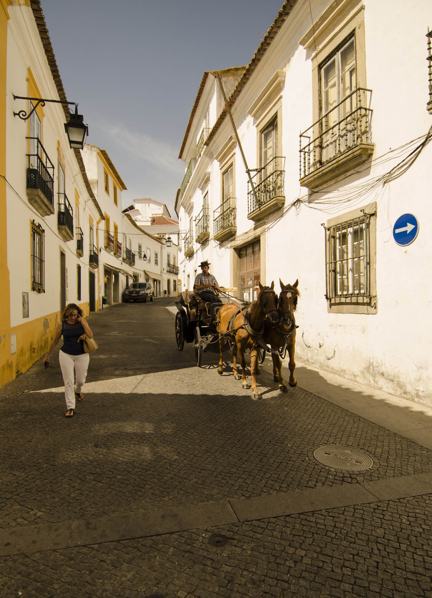 A team passes through the colorful streets of Evora Colorful streets of the city