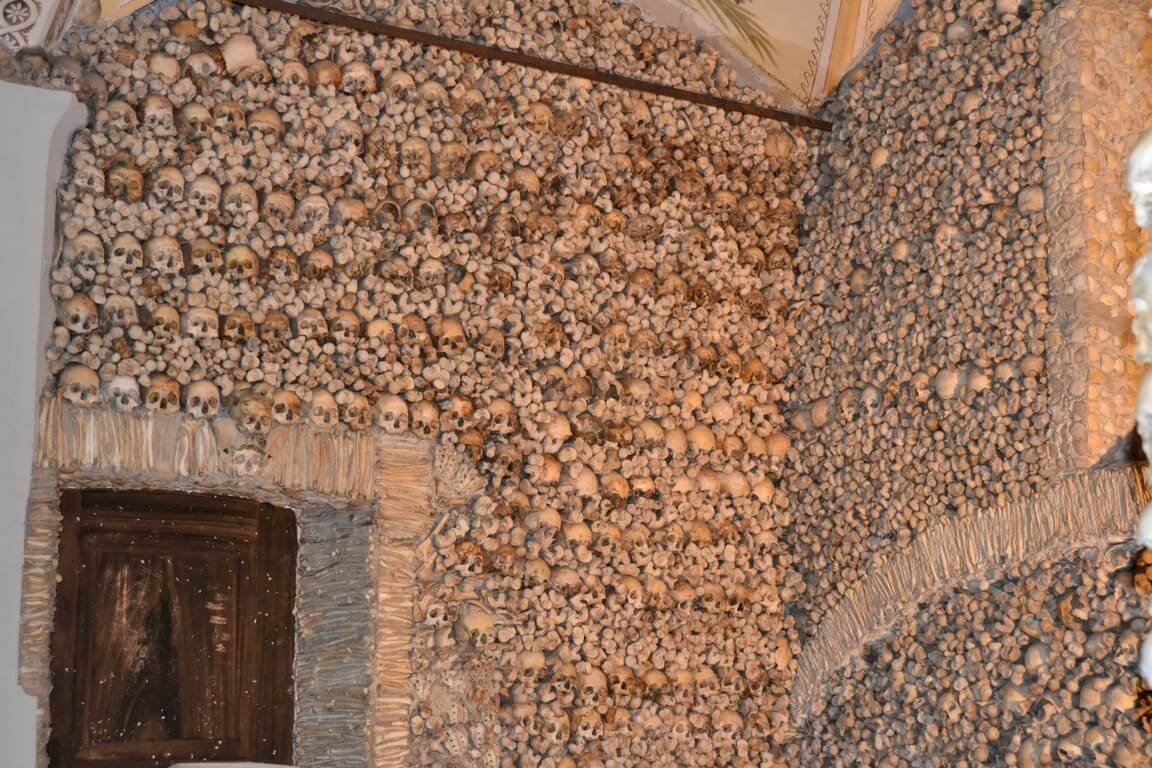The walls of the Chapel of Bones drained lined with bones and skulls Walls of the Chapel of Bones Drained