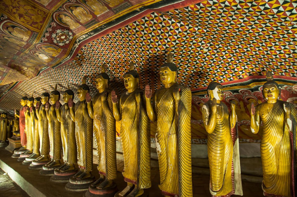Gold-plated Buddha figures in Maha Alut Cave at Dambulla Cave Temple, Sri Lanka Maha Alut Viharaya Cave