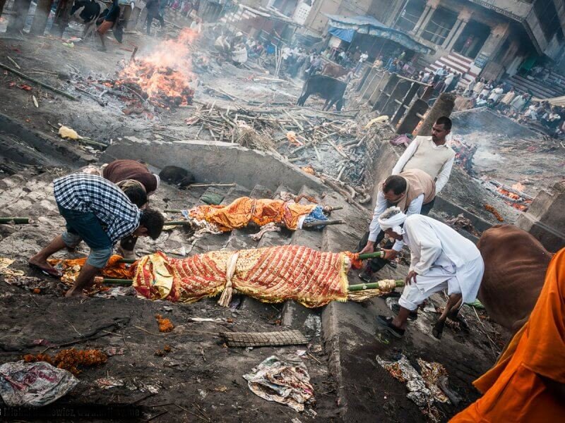 Crematorium workers with a corpse