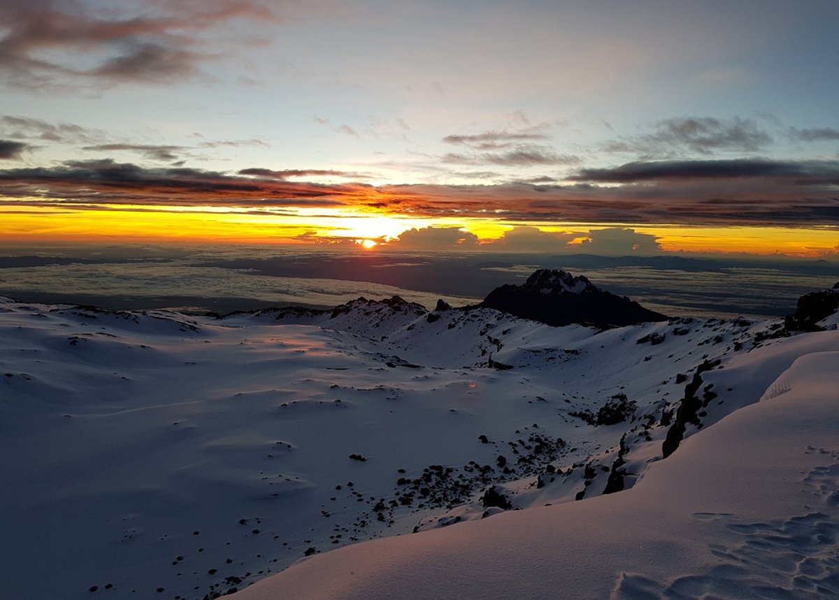 Watching the sunrise from the top of Kilimanjaro Sunrise from Kilimanjaro