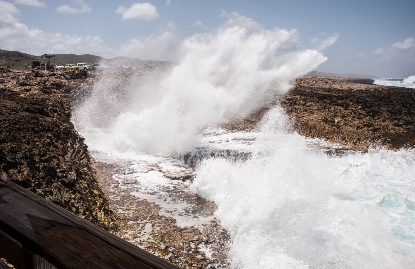 Rough waves break on the rocks Curacao National Park