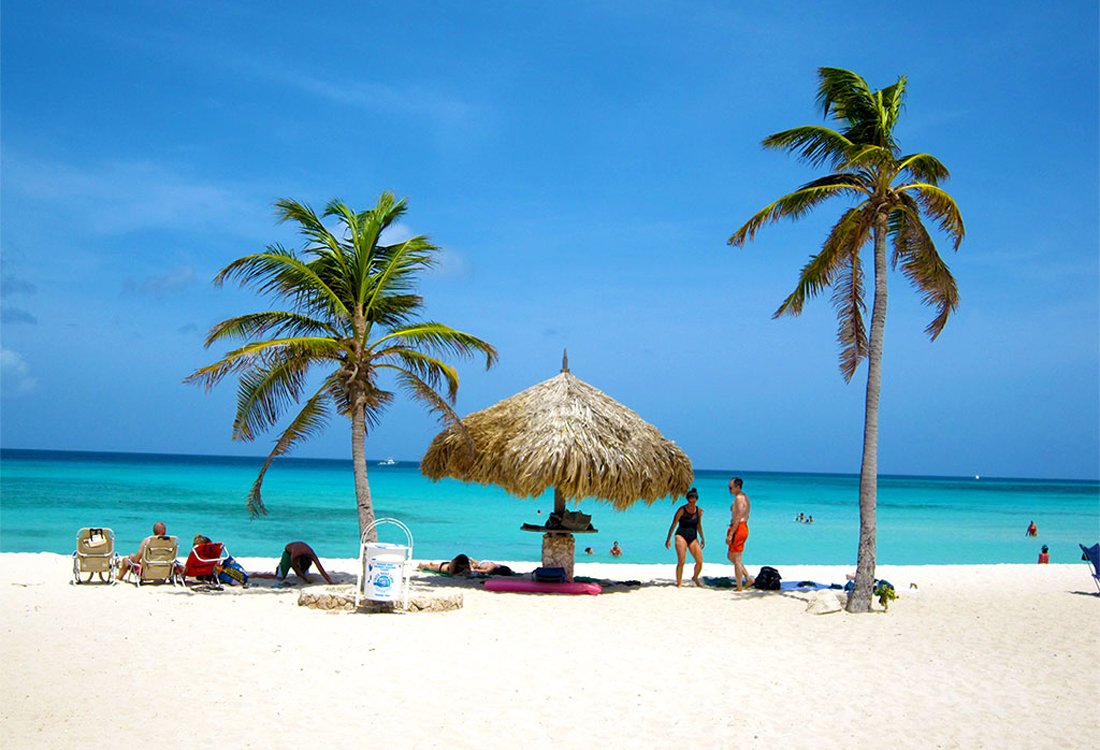 Relaxing under the palm trees at Arashi Beach Arashi Beach, Aruba