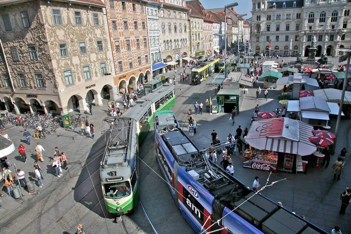 View of passing trams on the main square in Graz, Austria Transport interchange of the main square of Graz