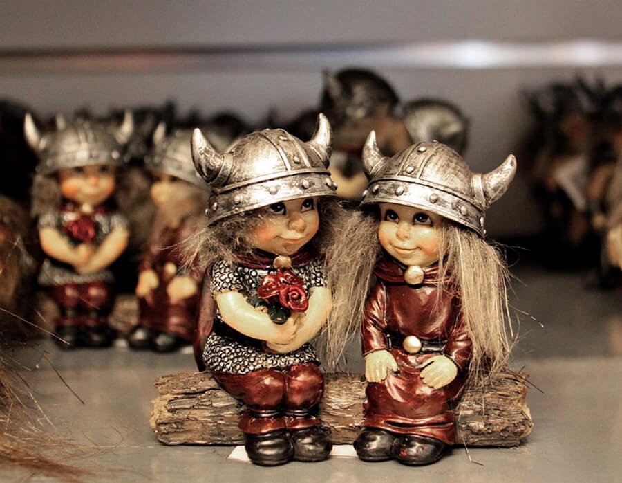 Viking figures sitting on a log Viking figurines