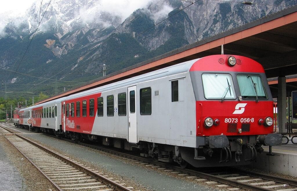 Red train at the Etztal railway station in Austria By train to the village of Ettsal