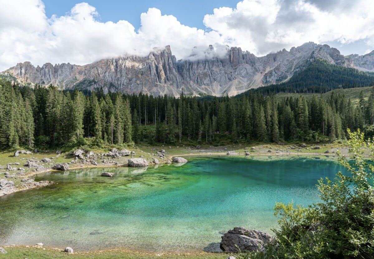 Lago di Carezza is a turquoise lake in the Dolomites. Lake Lago di Carezza in the Dolomites