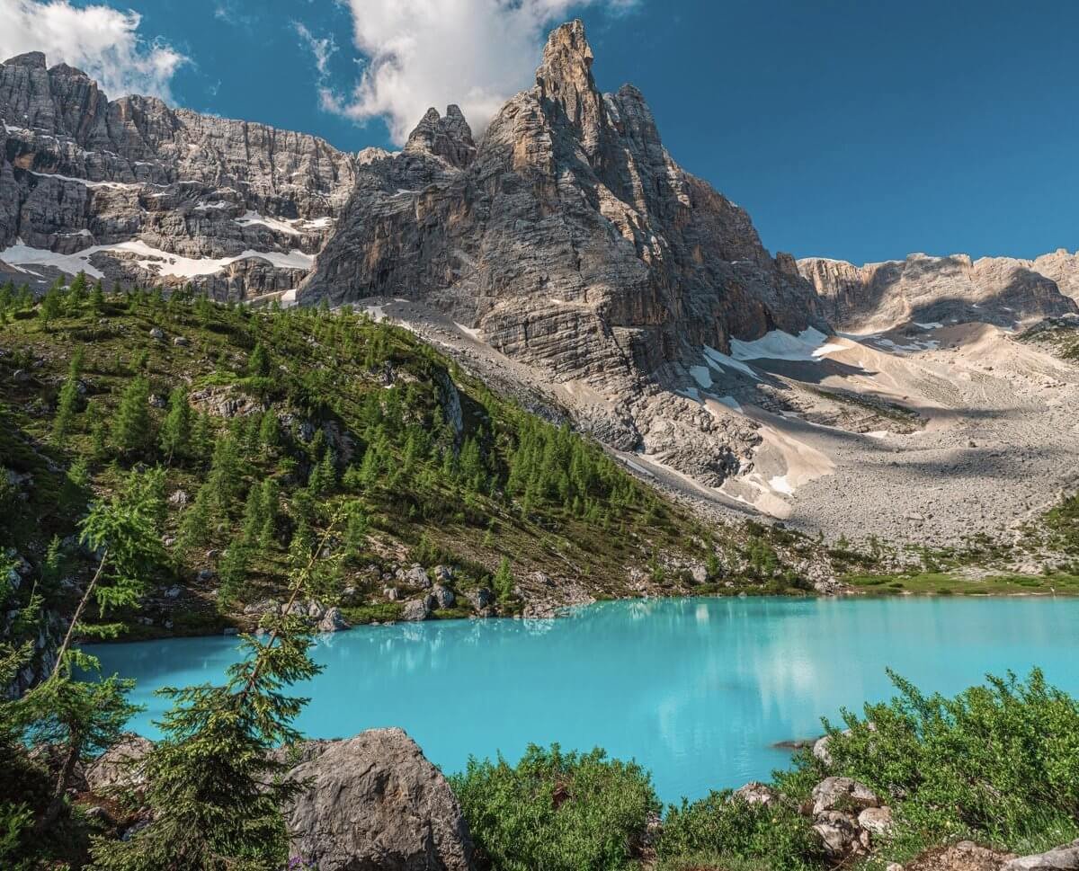 Lago di Sorapis is a lake with milky‑turquoise water. Lake Lago di Sorapis in the Dolomites