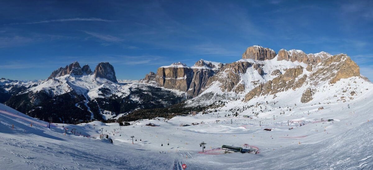 Val di Fassa is a budget‑friendly skiing region in the Dolomites. Val di Fassa: Dolomites, slopes, and mountains in winter.