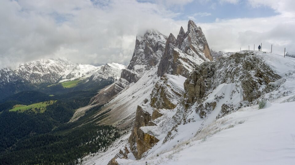 The jagged Odle (Geisler) peaks and the steep Seceda ridge above Val Gardena after an early snowfall
